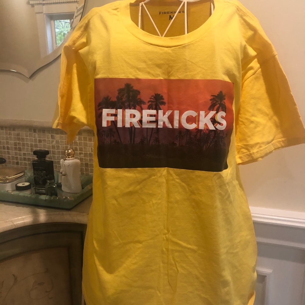Fire kicks yellow tee